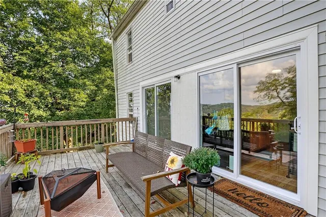 a view of a deck with furniture