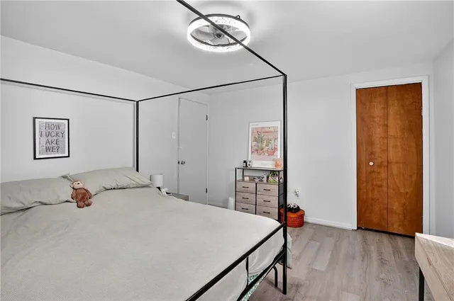 a bedroom with a bed and a table