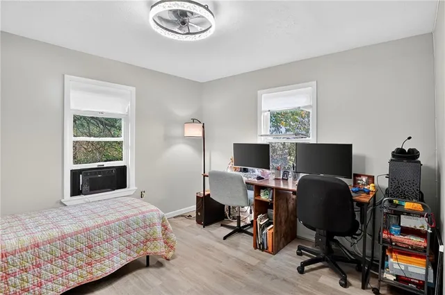 a bedroom with a workspace