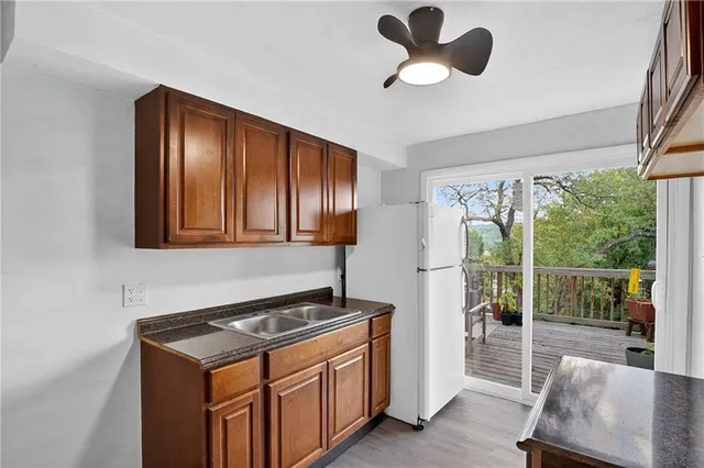 a kitchen with a stove and a refrigerator