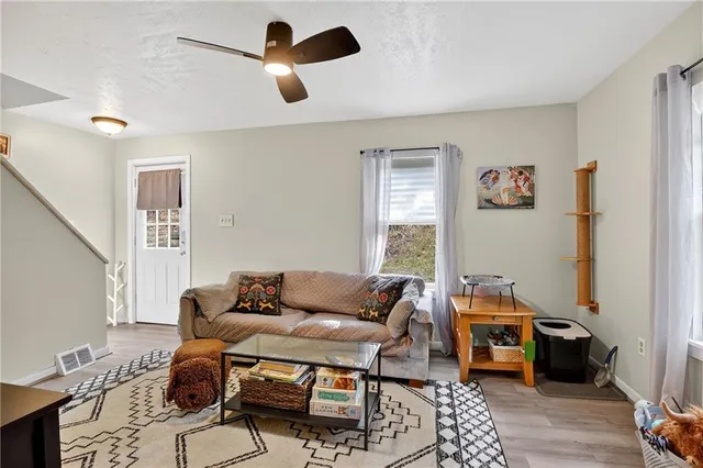 a living room with furniture and a window