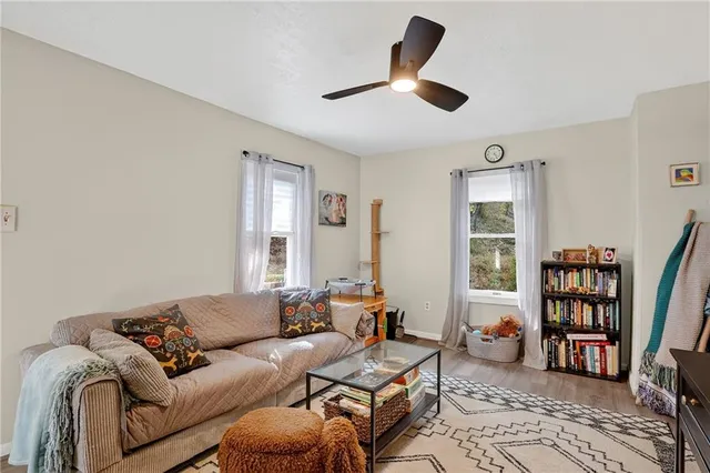 a living room with furniture and a window
