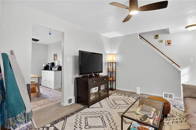 a bedroom with furniture and a flat screen tv