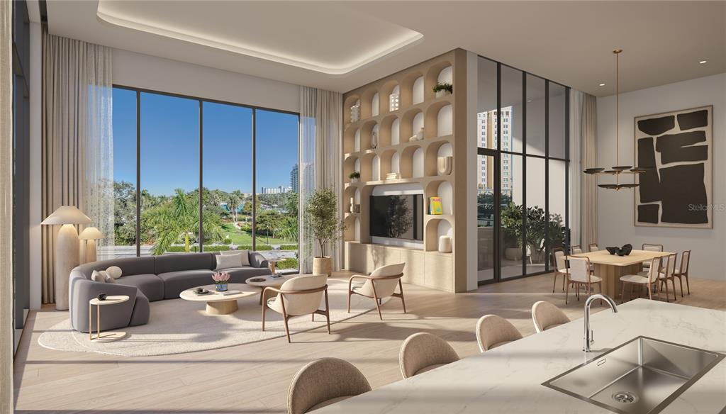 668 Quay Commons, Unit 104 Sarasota, FL 34236 - Photo 2 of 10 a living room with furniture and a flat screen tv