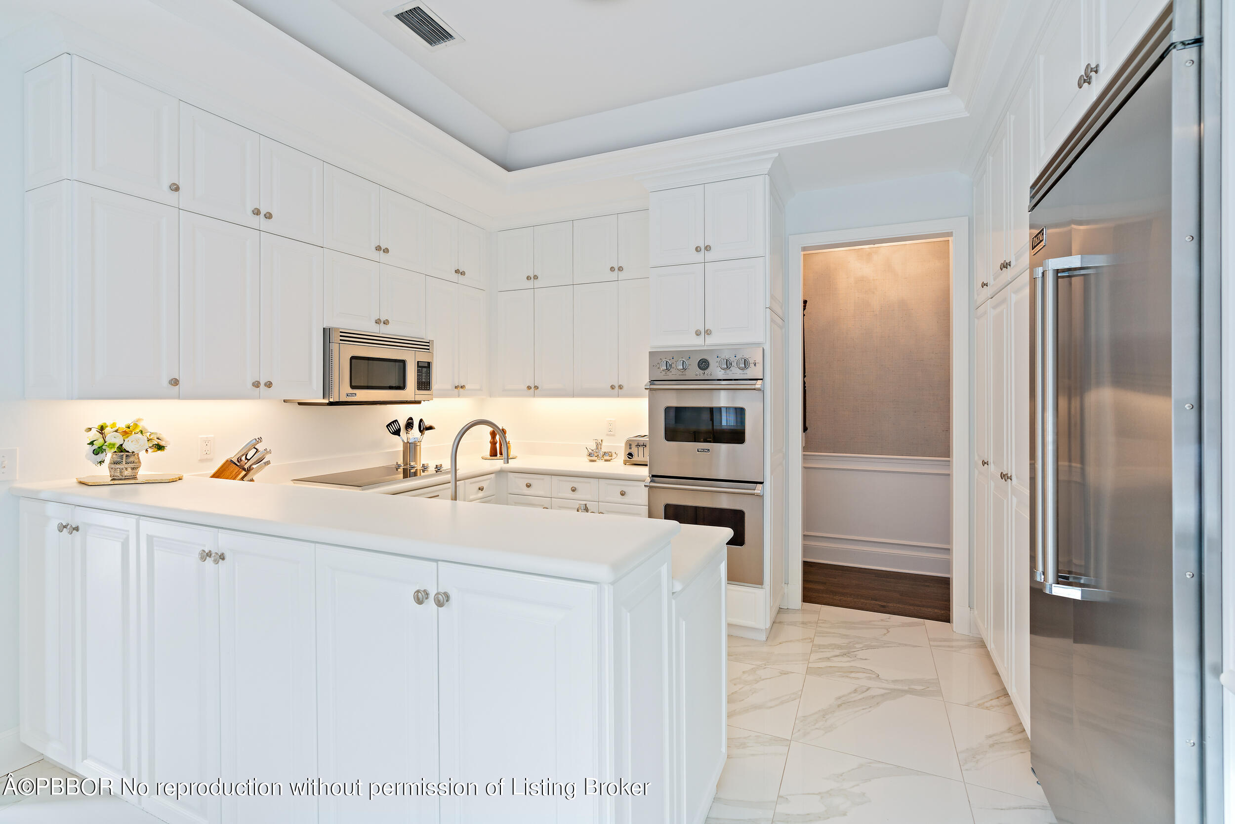 310 Plantation Road Palm Beach, FL 33480 - Photo 12 of 38 a kitchen with stainless steel appliances a refrigerator sink and cabinets
