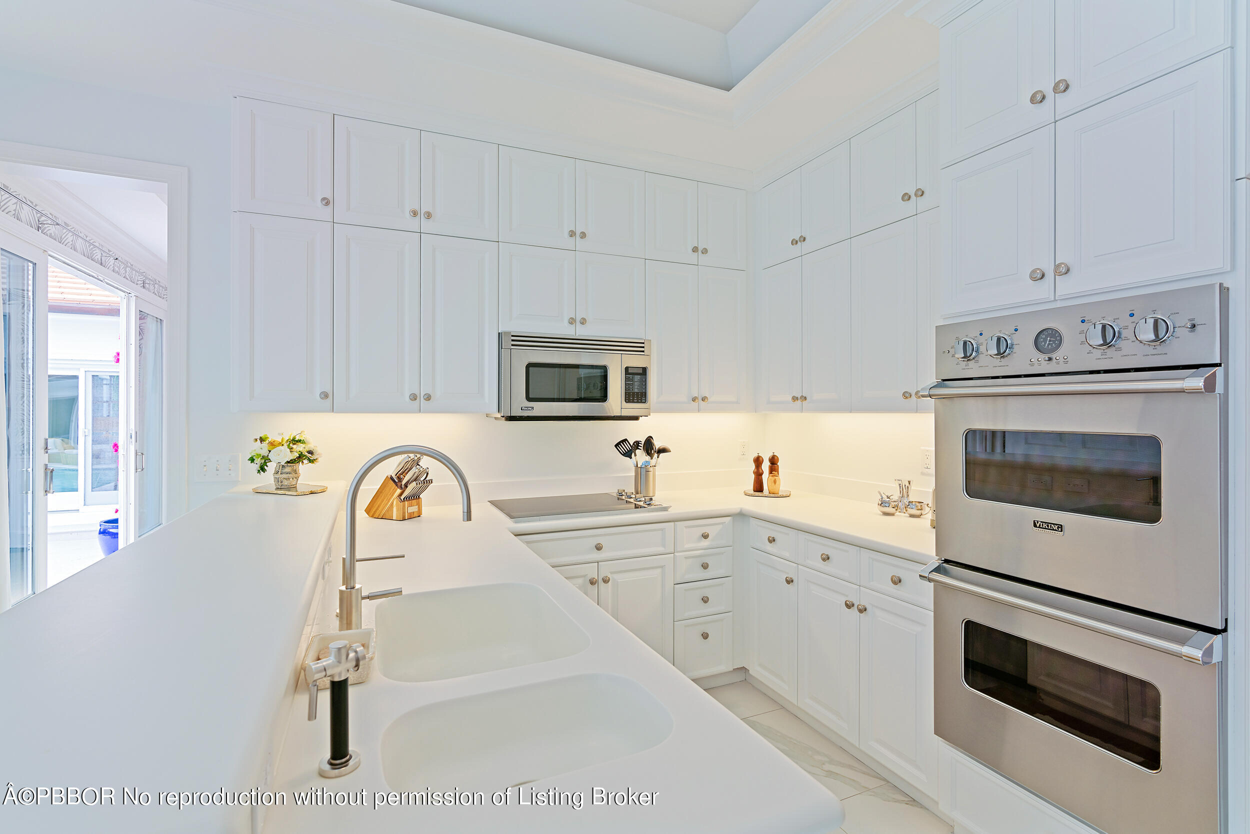 310 Plantation Road Palm Beach, FL 33480 - Photo 13 of 38 a kitchen with granite countertop a sink a stove and cabinets