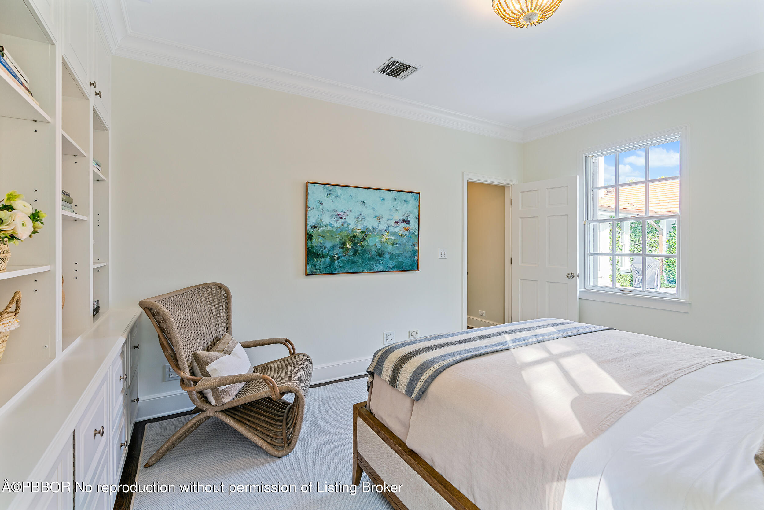 310 Plantation Road Palm Beach, FL 33480 - Photo 20 of 38 a bedroom with a bed and a chair