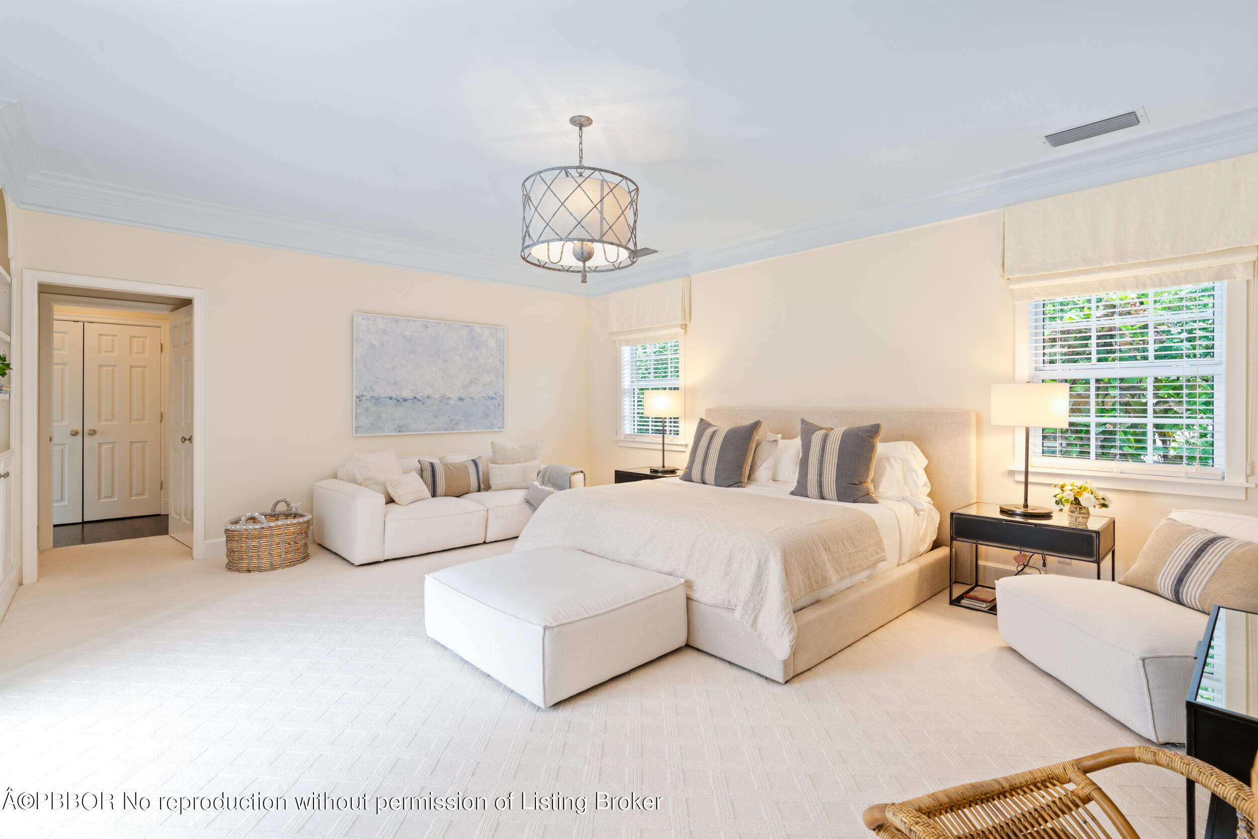310 Plantation Road Palm Beach, FL 33480 - Photo 22 of 38 a spacious bedroom with a bed and large window