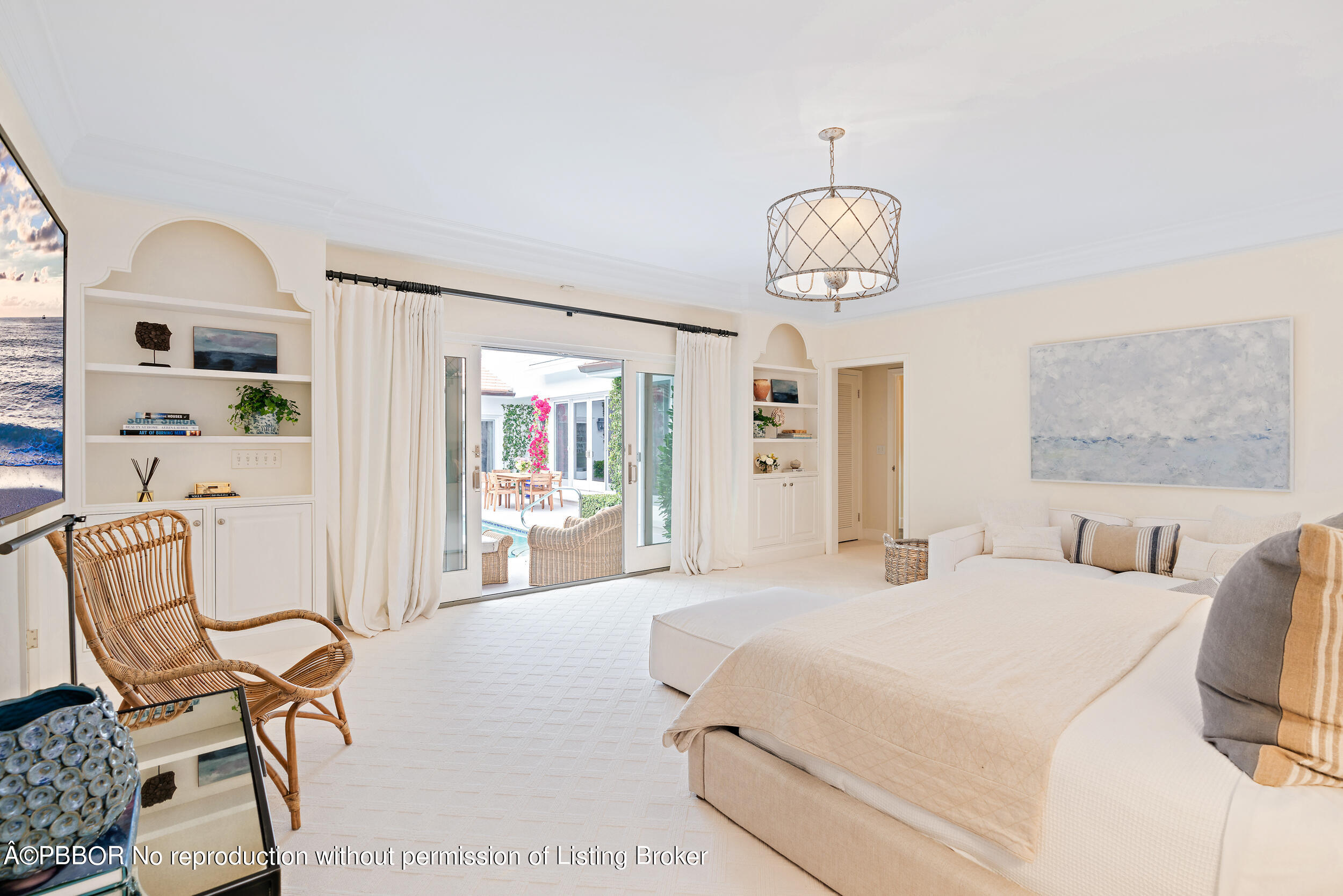 310 Plantation Road Palm Beach, FL 33480 - Photo 23 of 38 a bedroom with a bed a chair and potted plant on the table