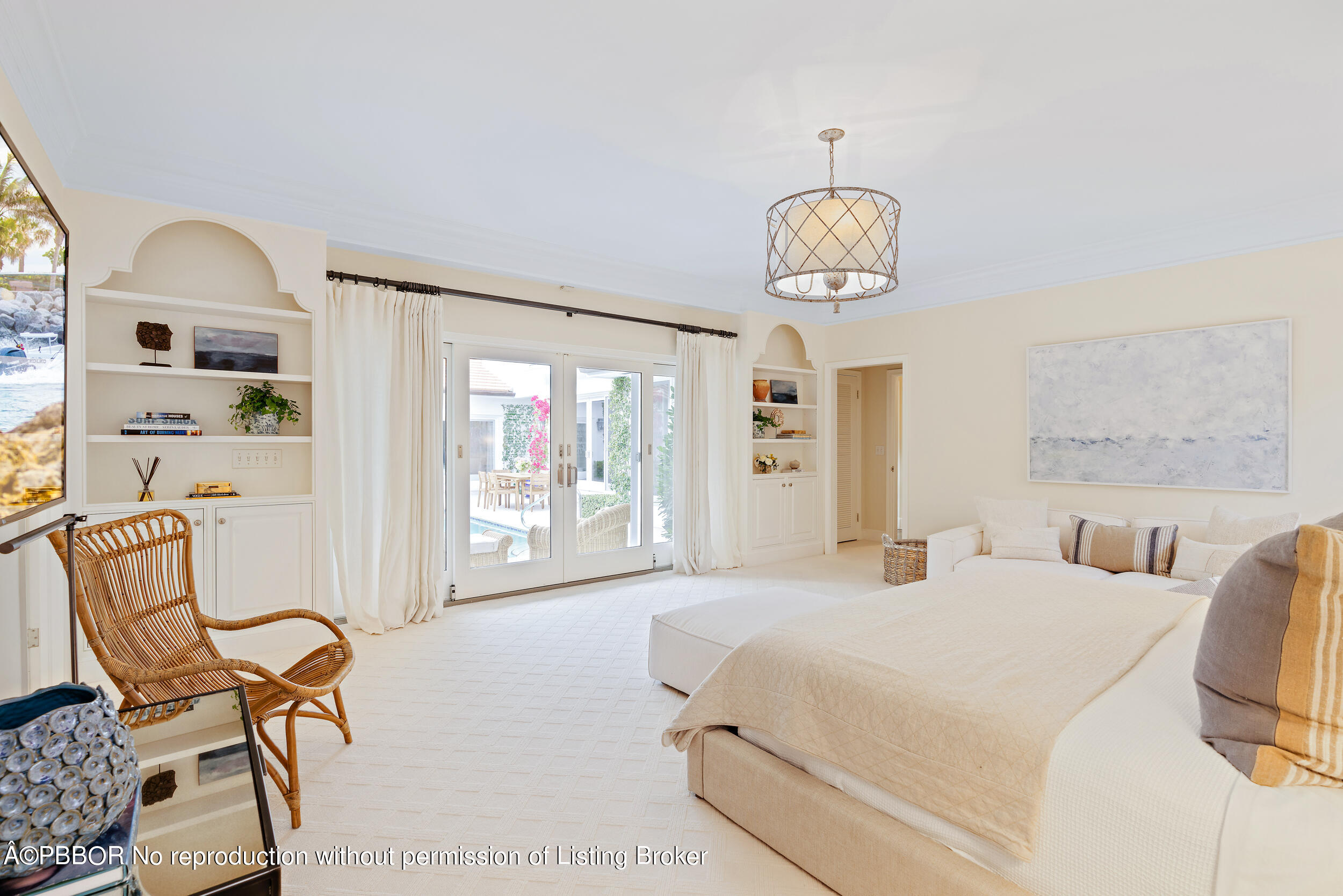 310 Plantation Road Palm Beach, FL 33480 - Photo 24 of 38 a bedroom with a bed a chair and a large window