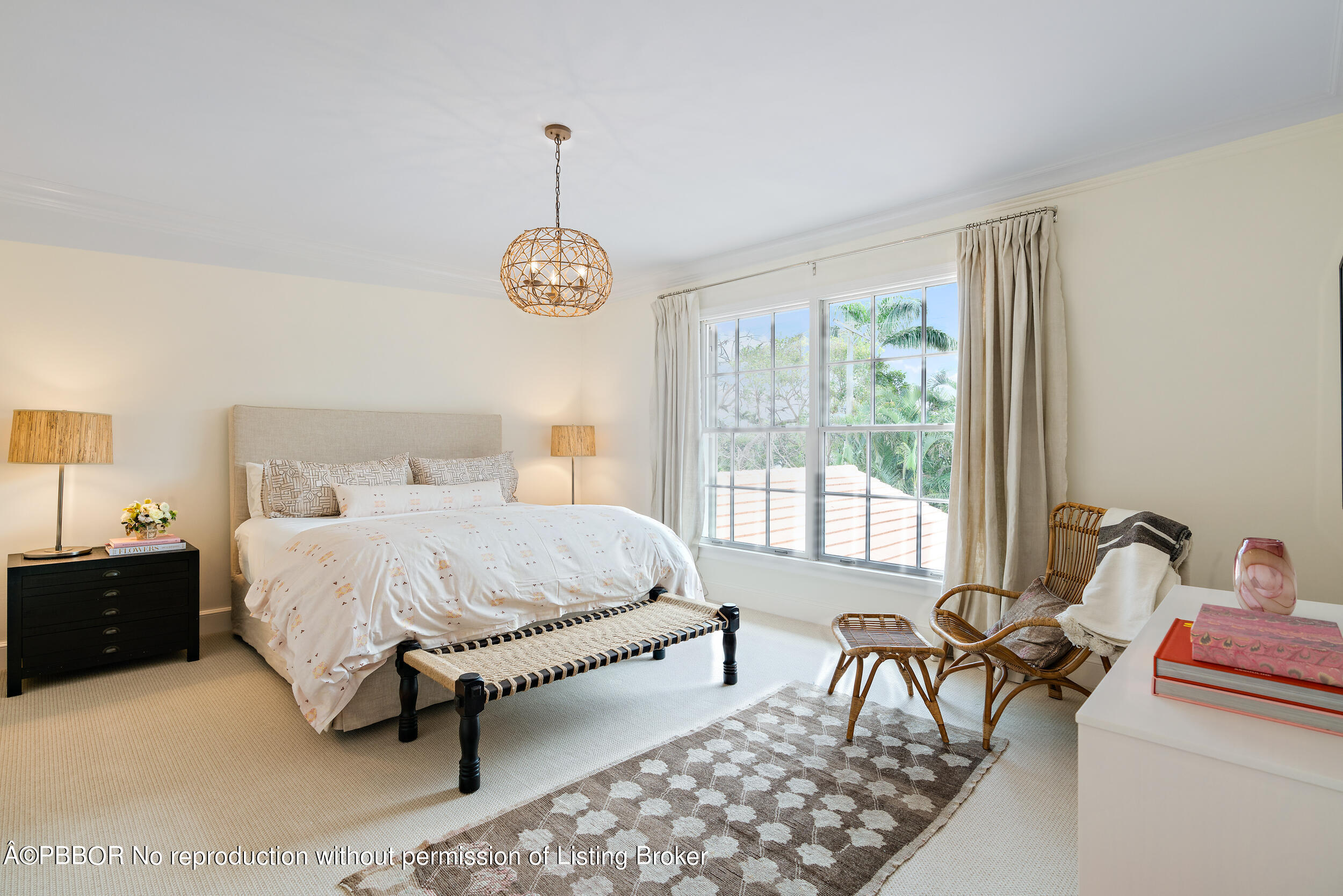 310 Plantation Road Palm Beach, FL 33480 - Photo 29 of 38 a spacious bedroom with a bed and a chandelier