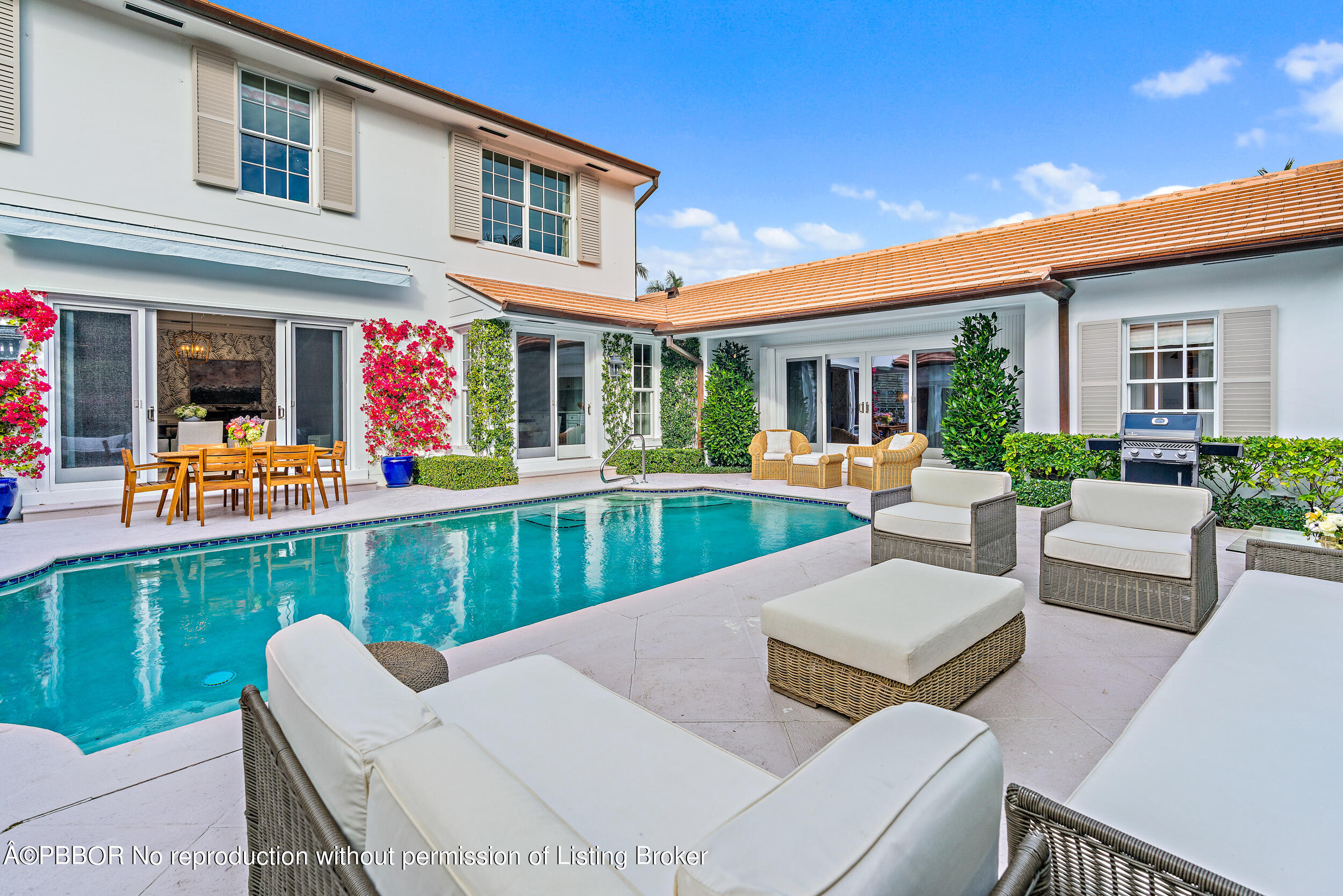 310 Plantation Road Palm Beach, FL 33480 - Photo 3 of 38 a view of a house with a backyard and patio