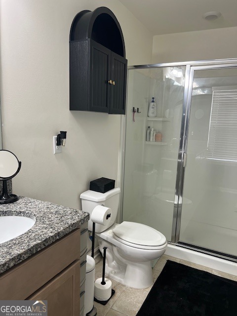 832 Ambient Way Atlanta, GA 30331 - Photo 20 of 32 a bathroom with a granite countertop toilet sink and shower