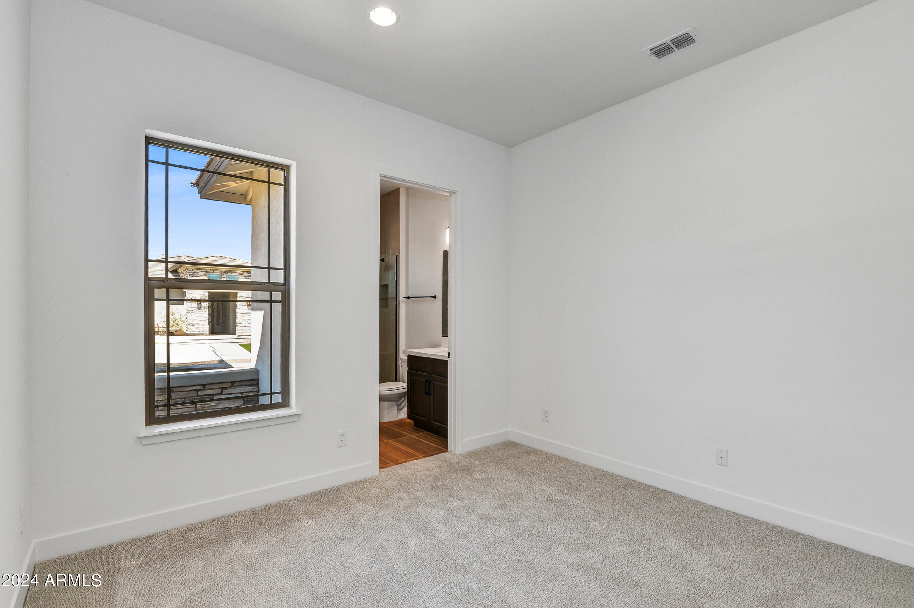 20717 West Rattler Road Buckeye, AZ 85396 - Photo 17 of 30 an empty room with windows and closet