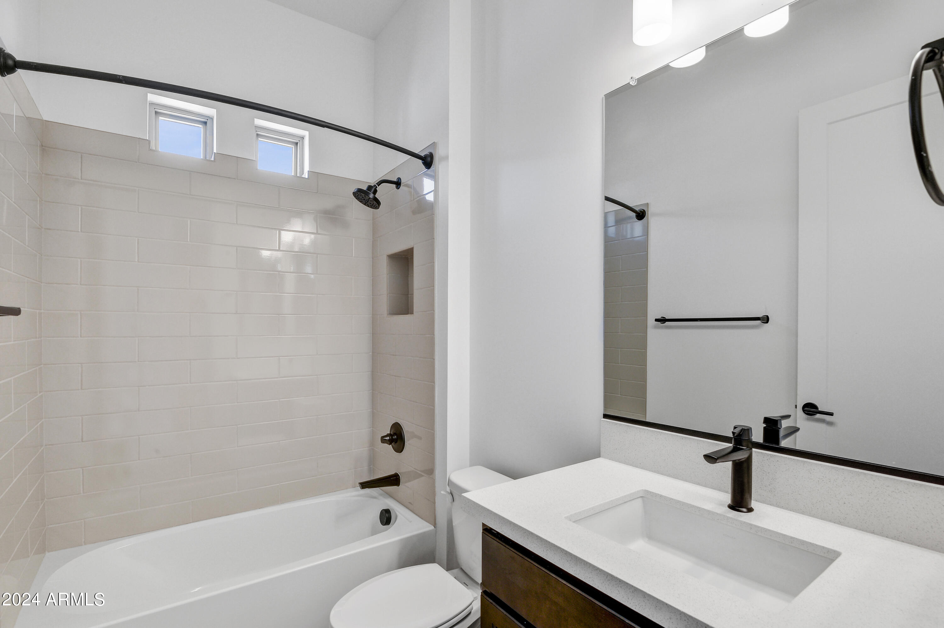 20717 West Rattler Road Buckeye, AZ 85396 - Photo 19 of 30 a bathroom with a sink and a mirror