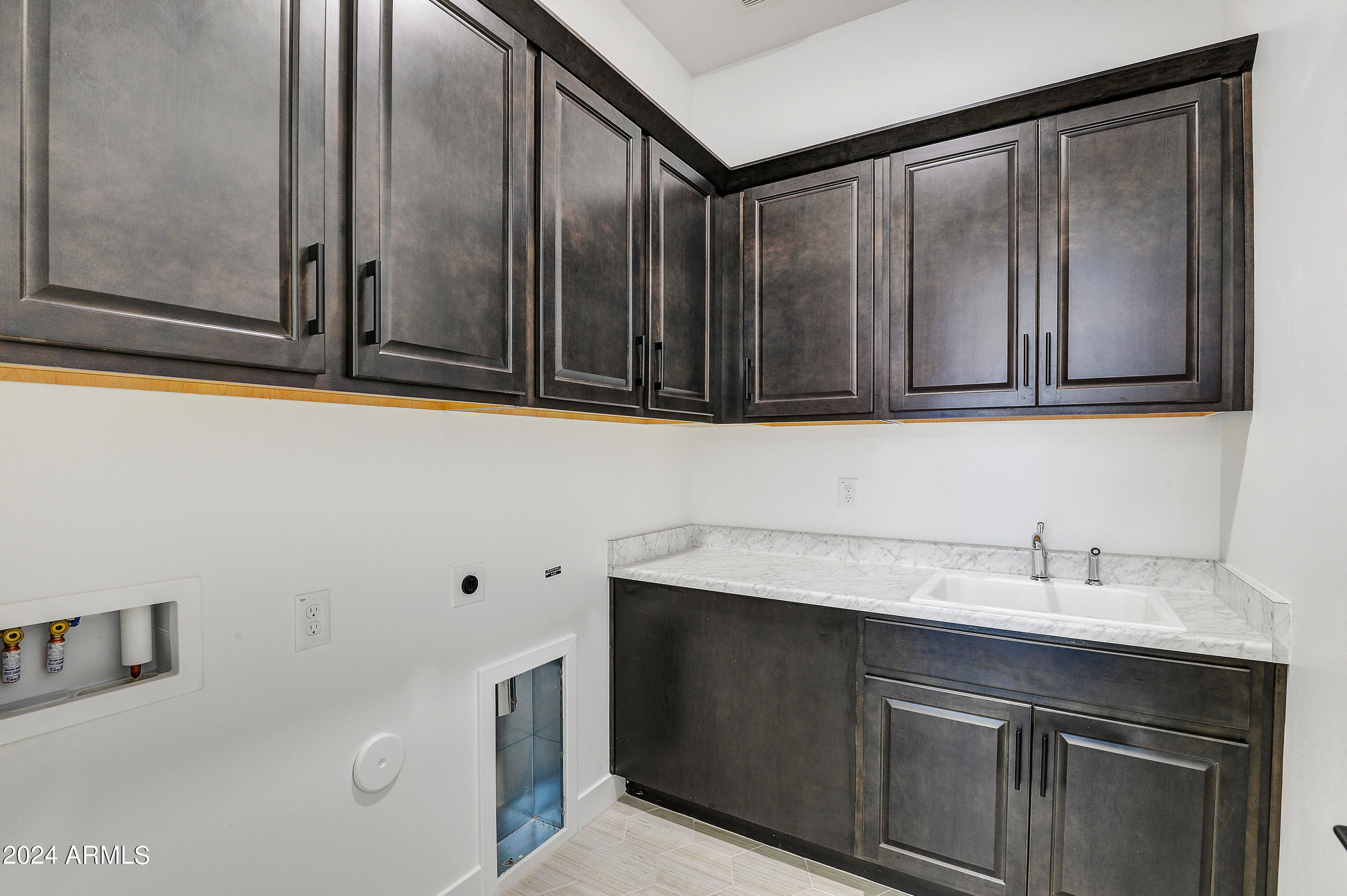 20717 West Rattler Road Buckeye, AZ 85396 - Photo 20 of 30 a kitchen with a sink and cabinets