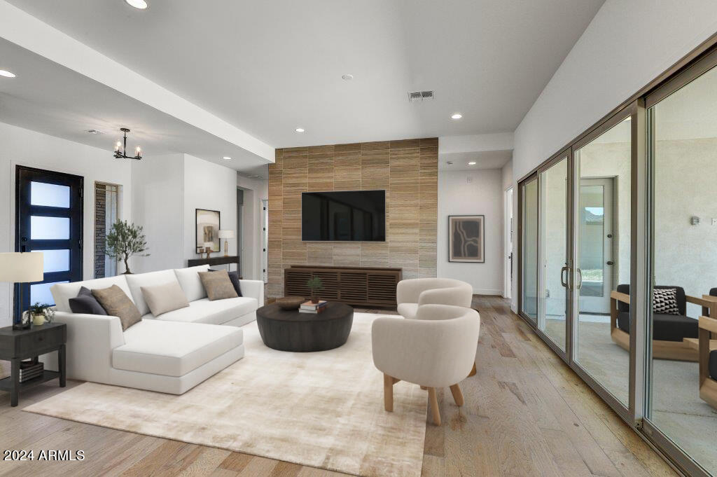 20717 West Rattler Road Buckeye, AZ 85396 - Photo 2 of 30 a living room with furniture and a flat screen tv