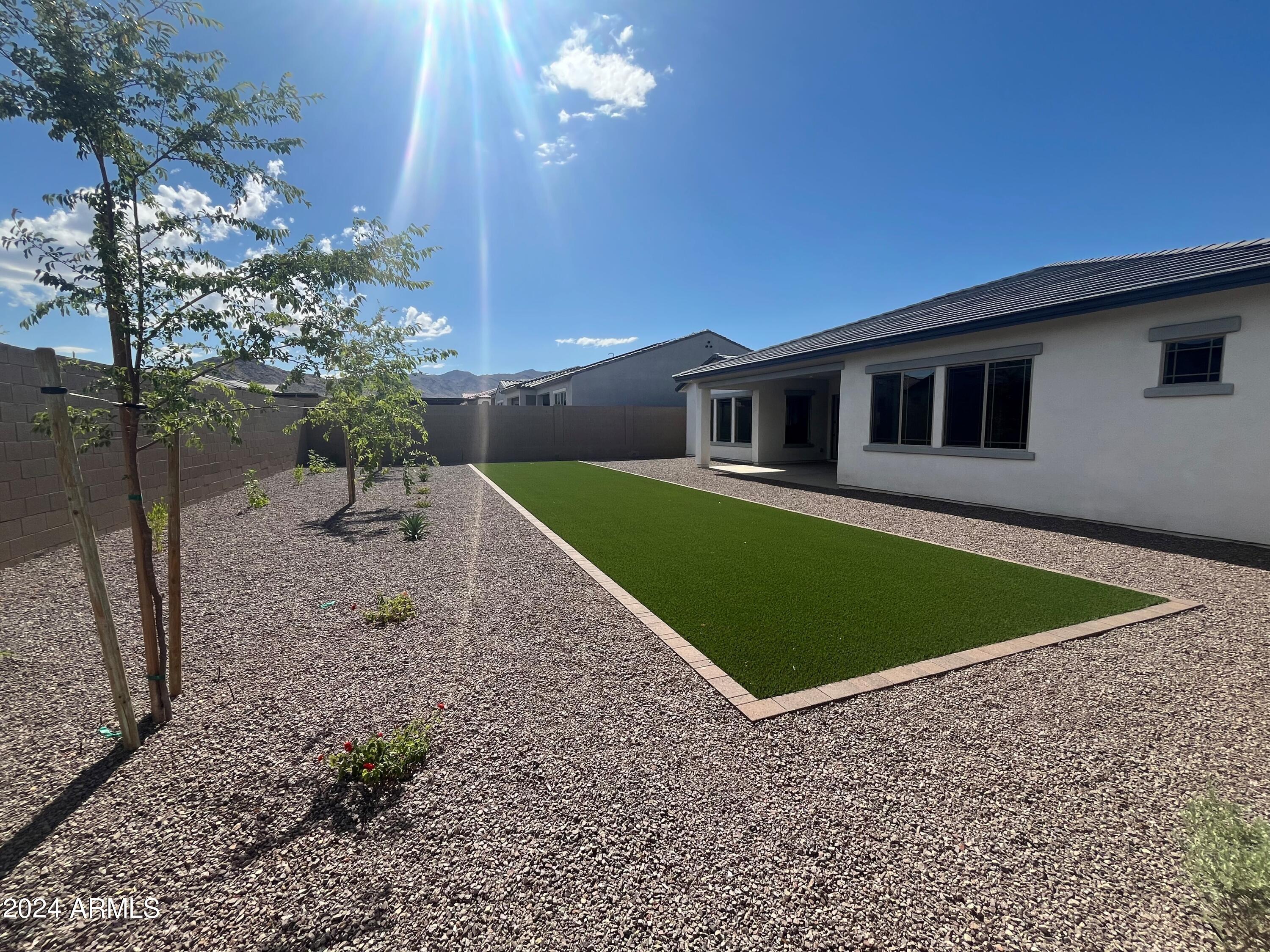 20717 West Rattler Road Buckeye, AZ 85396 - Photo 22 of 30 a view of a house with a backyard