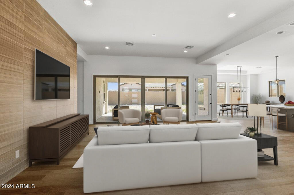 20717 West Rattler Road Buckeye, AZ 85396 - Photo 3 of 30 a living room with furniture and a flat screen tv