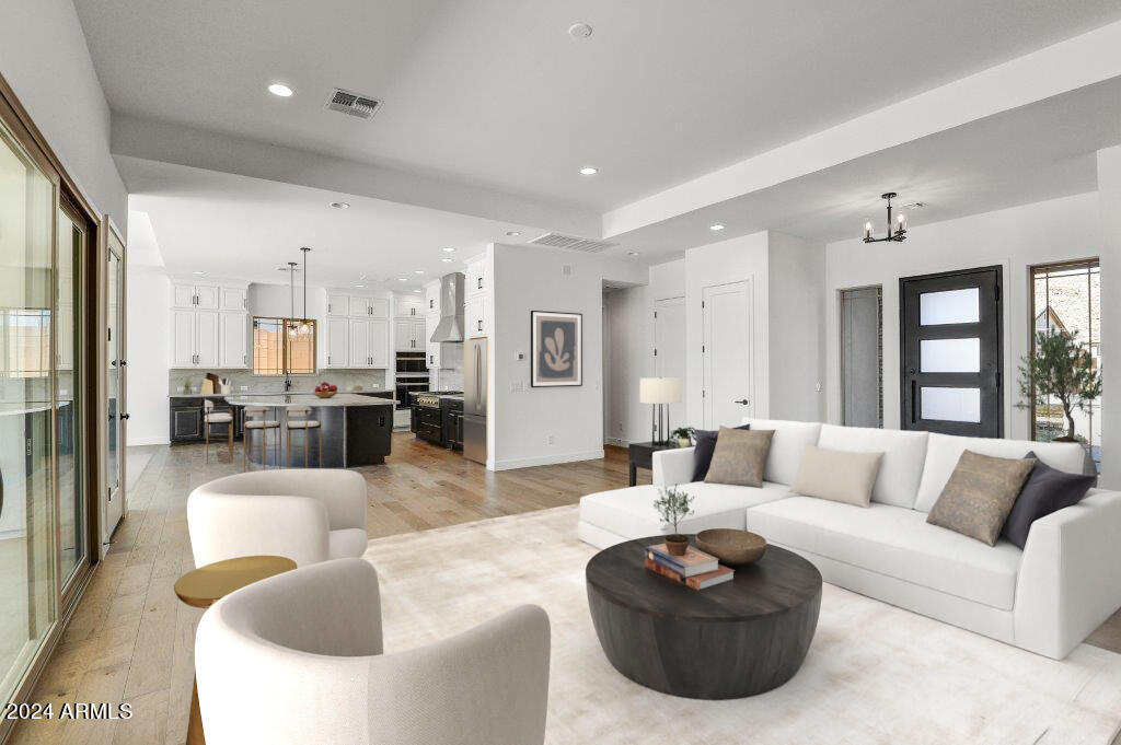 20717 West Rattler Road Buckeye, AZ 85396 - Photo 4 of 30 a living room with furniture kitchen view and a large window