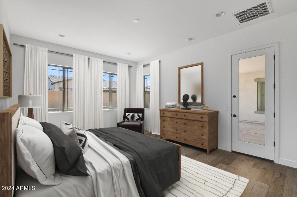 20717 West Rattler Road Buckeye, AZ 85396 - Photo 5 of 30 a bedroom with a bed and a dresser