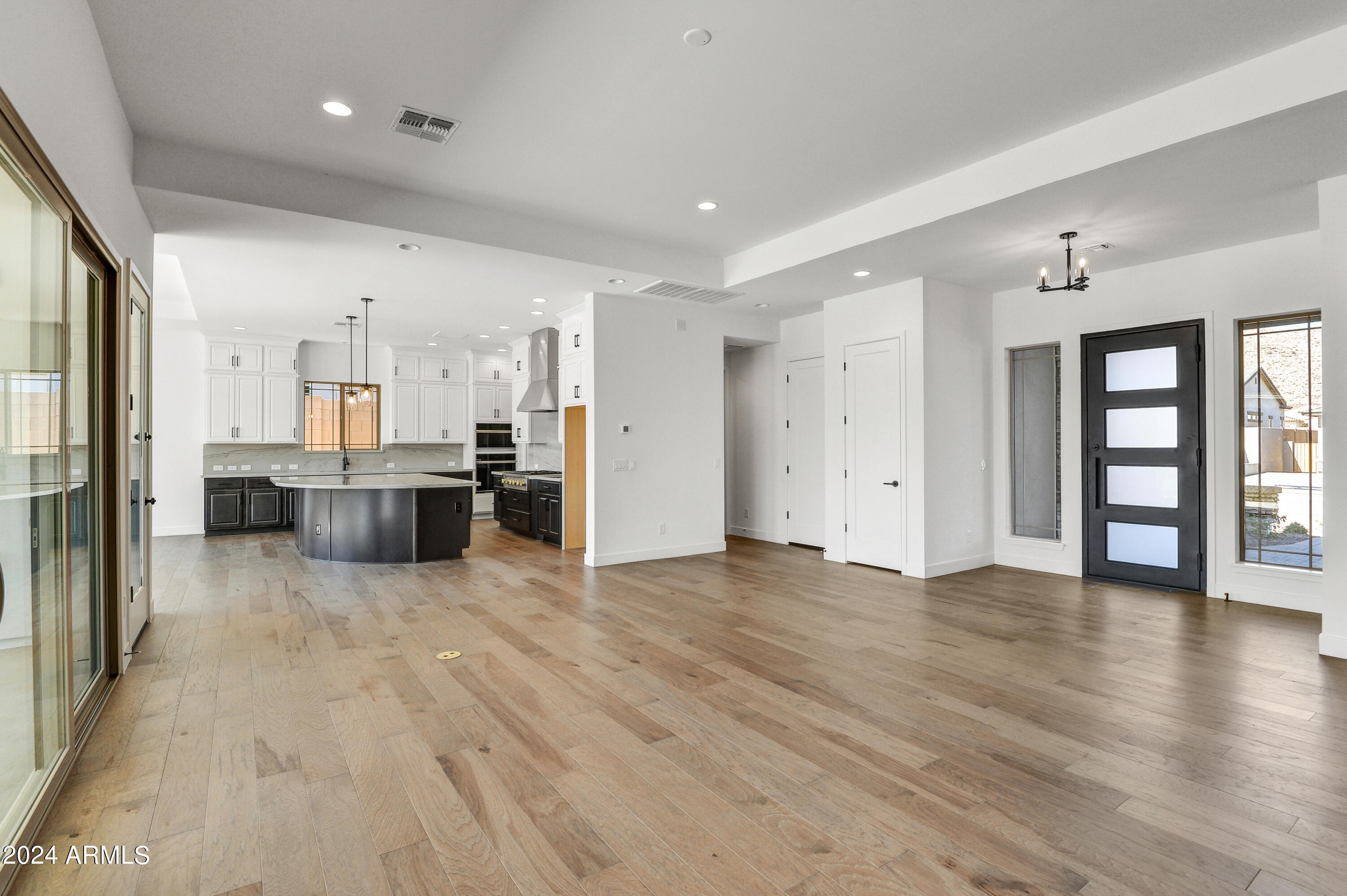 20717 West Rattler Road Buckeye, AZ 85396 - Photo 8 of 30 a view of a kitchen with wooden floor