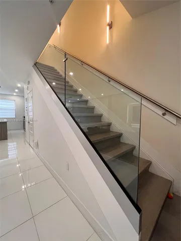 a view of entryway and kitchen