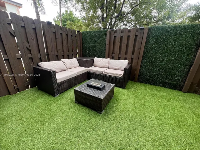 a view of a yard with furniture