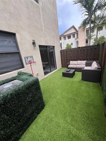 a large bed sitting in a bedroom next to a window
