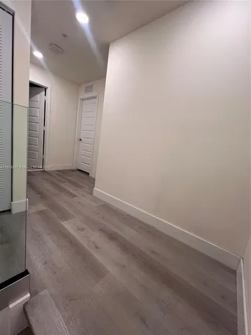 a bedroom with two beds and a window