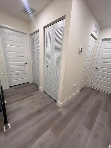 a bedroom with a bed and a television