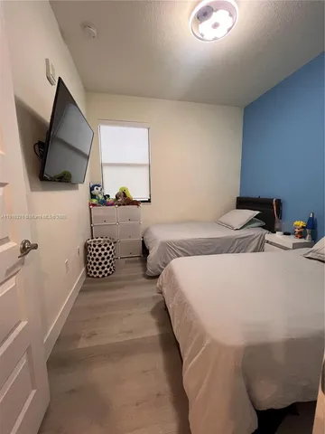 a bathroom with a sink a toilet a tub and shower