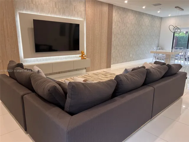 a living room with a couch and a flat screen tv