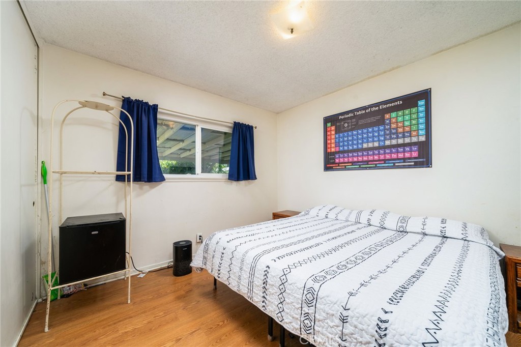 211 Benicia Road Diamond Bar, CA 91765 - Photo 14 of 24 a bedroom with a bed and a painting on the wall