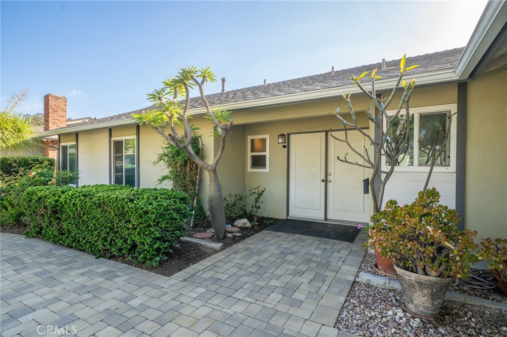211 Benicia Road Diamond Bar, CA 91765 - Photo 3 of 24 a view of a house with potted plants