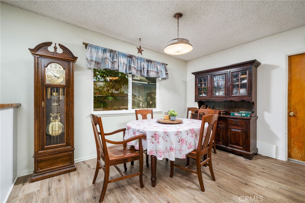211 Benicia Road Diamond Bar, CA 91765 - Photo 10 of 24 a view of a dining room with furniture window and wooden floor