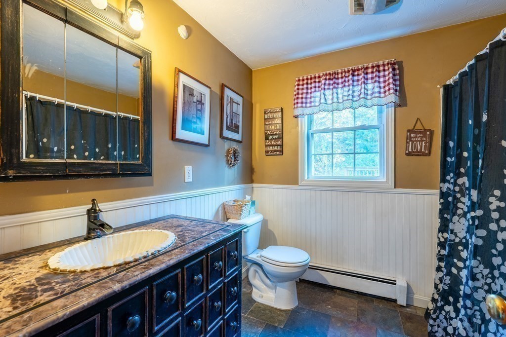 74 Katrina Road Middleboro, MA 02346 - Photo 16 of 37 a bathroom with a granite countertop sink and a toilet