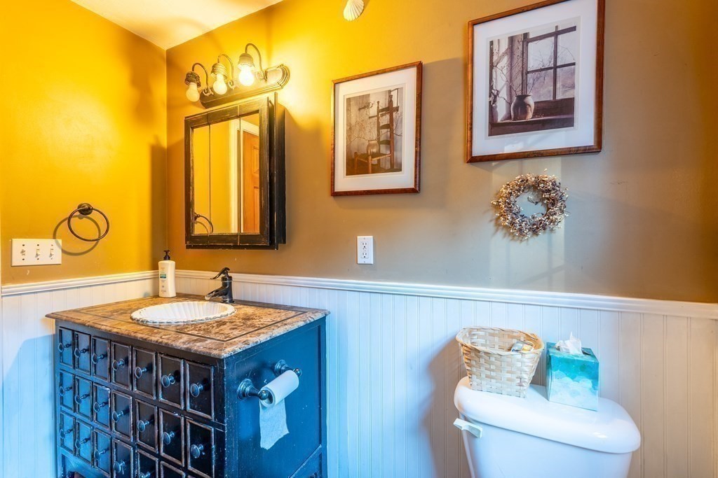 74 Katrina Road Middleboro, MA 02346 - Photo 17 of 37 a bathroom with a granite countertop sink and a mirror