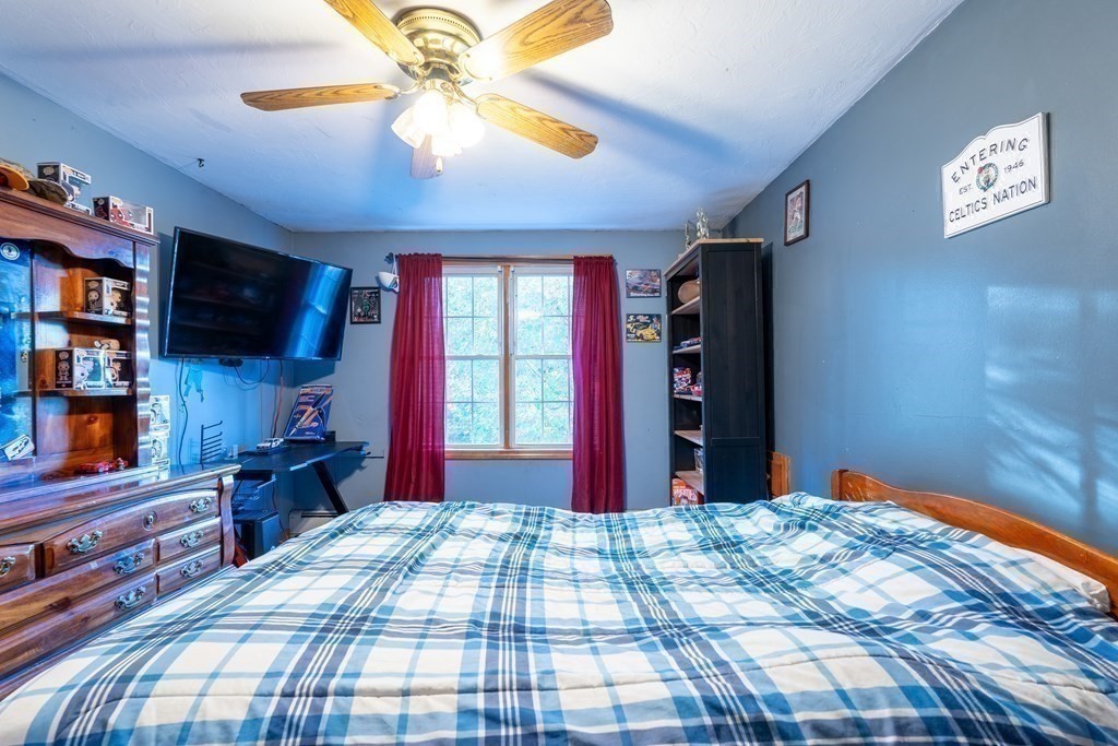 74 Katrina Road Middleboro, MA 02346 - Photo 19 of 37 a bed room with a bed and a television