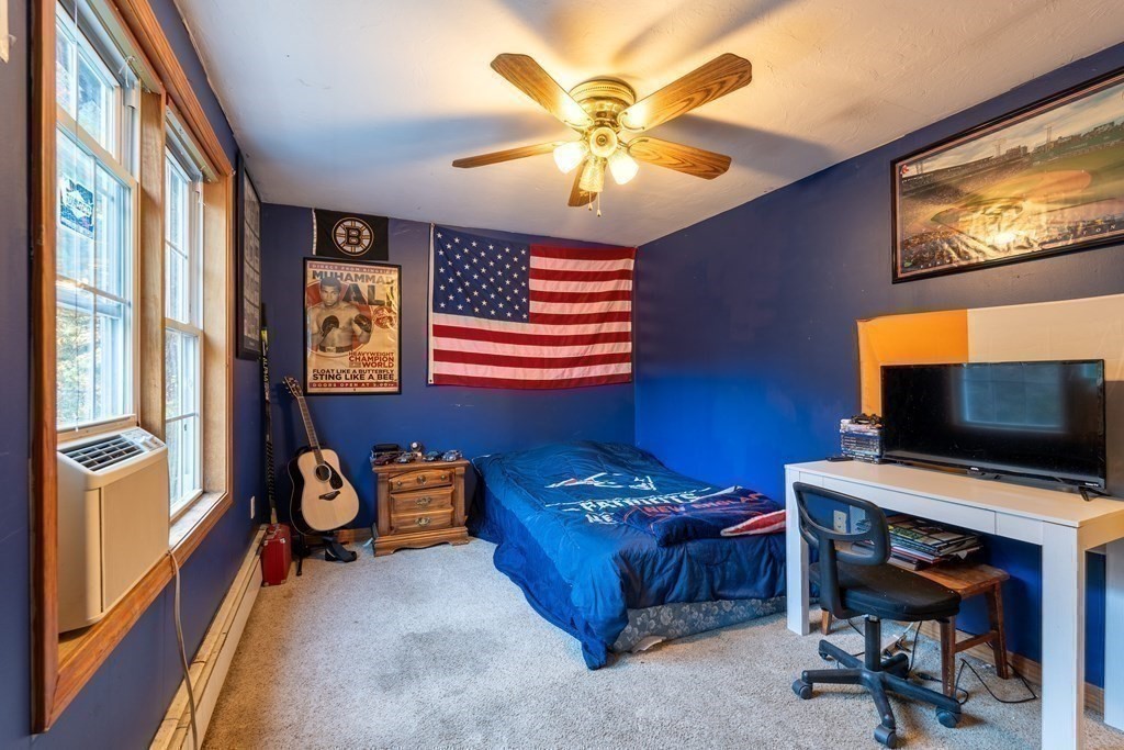 74 Katrina Road Middleboro, MA 02346 - Photo 21 of 37 a bedroom with furniture and a flat screen tv