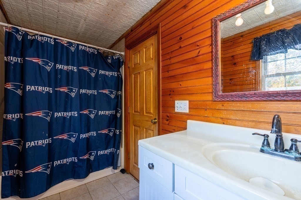 74 Katrina Road Middleboro, MA 02346 - Photo 23 of 37 a bathroom with a sink and a mirror