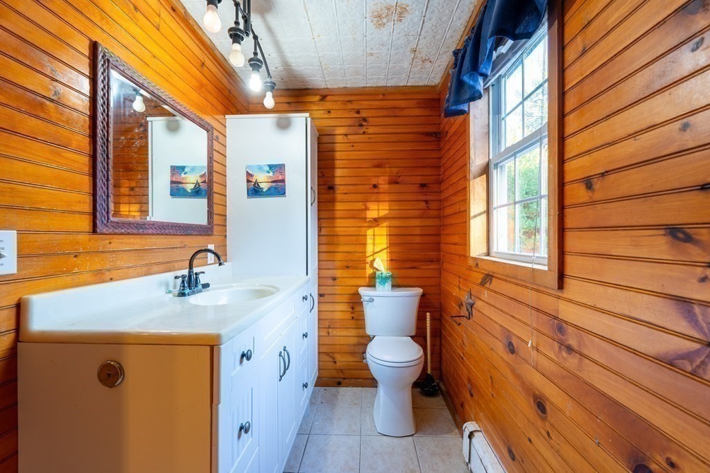 74 Katrina Road Middleboro, MA 02346 - Photo 24 of 37 a bathroom with a sink a toilet and shower curtain