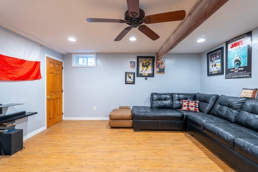 74 Katrina Road Middleboro, MA 02346 - Photo 31 of 37 a living room with furniture and a flat screen tv