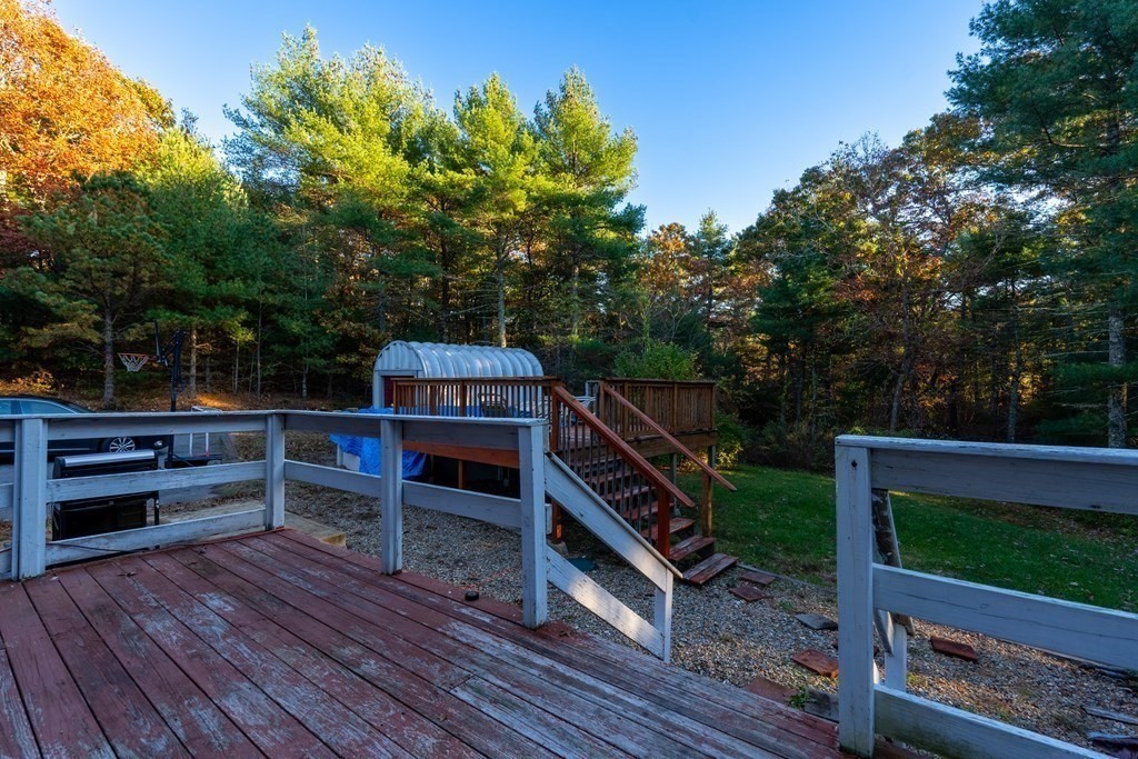 74 Katrina Road Middleboro, MA 02346 - Photo 6 of 37 a view of a wooden deck and a yard in the back