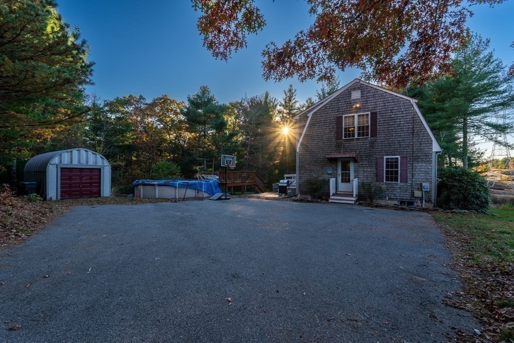 74 Katrina Road Middleboro, MA 02346 - Photo 7 of 37 a view of a house with a yard and a large tree