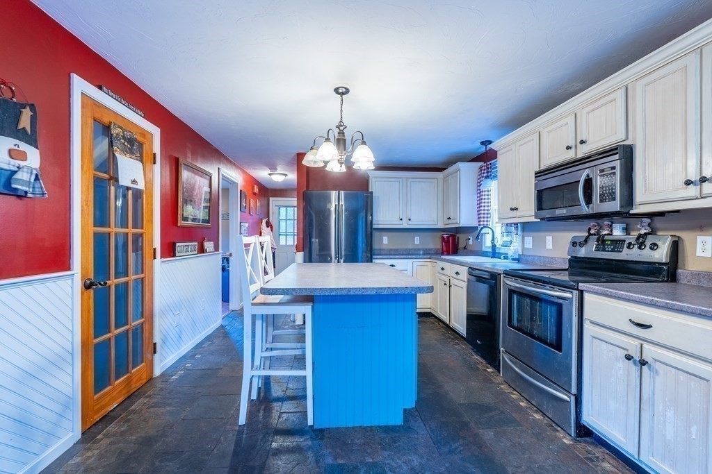 74 Katrina Road Middleboro, MA 02346 - Photo 9 of 37 a kitchen with stainless steel appliances granite countertop a stove and a sink