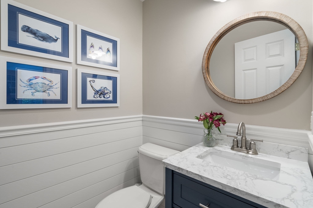 64 Gold Leaf Lane, Unit 64 Mashpee, MA 02649 - Photo 11 of 38 a bathroom with a toilet and a sink