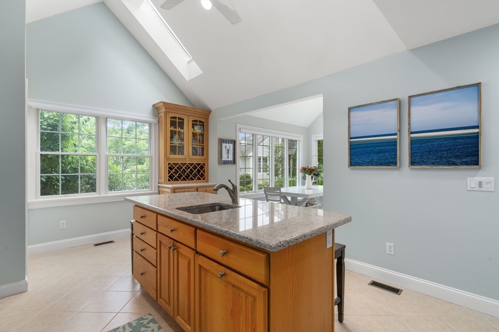 64 Gold Leaf Lane, Unit 64 Mashpee, MA 02649 - Photo 14 of 38 a kitchen with granite countertop a sink and a window