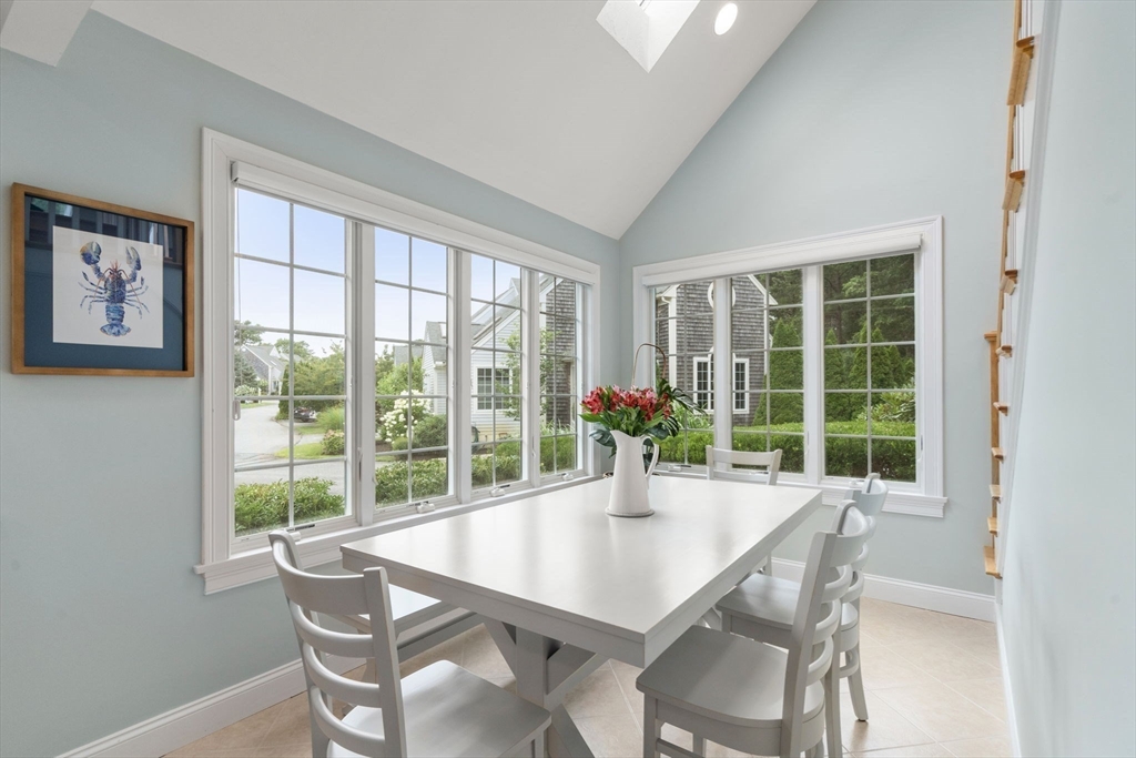 64 Gold Leaf Lane, Unit 64 Mashpee, MA 02649 - Photo 16 of 38 a view of a dining room with furniture and window