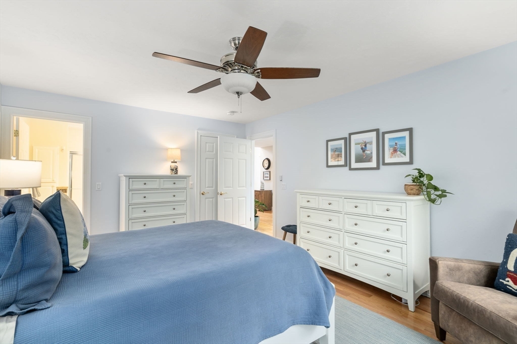 64 Gold Leaf Lane, Unit 64 Mashpee, MA 02649 - Photo 19 of 38 a bedroom with a bed and furniture